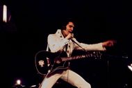 Elvis Presley on stage (Image via Getty)